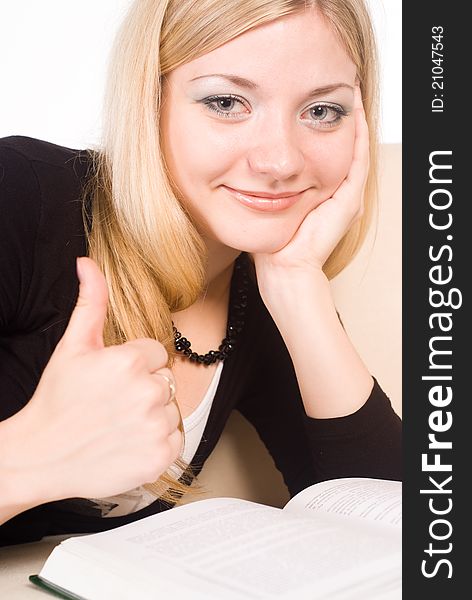 Portrait of a cute woman reading on a white