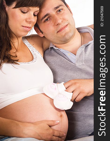 Portrait of a nice pregnant couple on a white. Portrait of a nice pregnant couple on a white