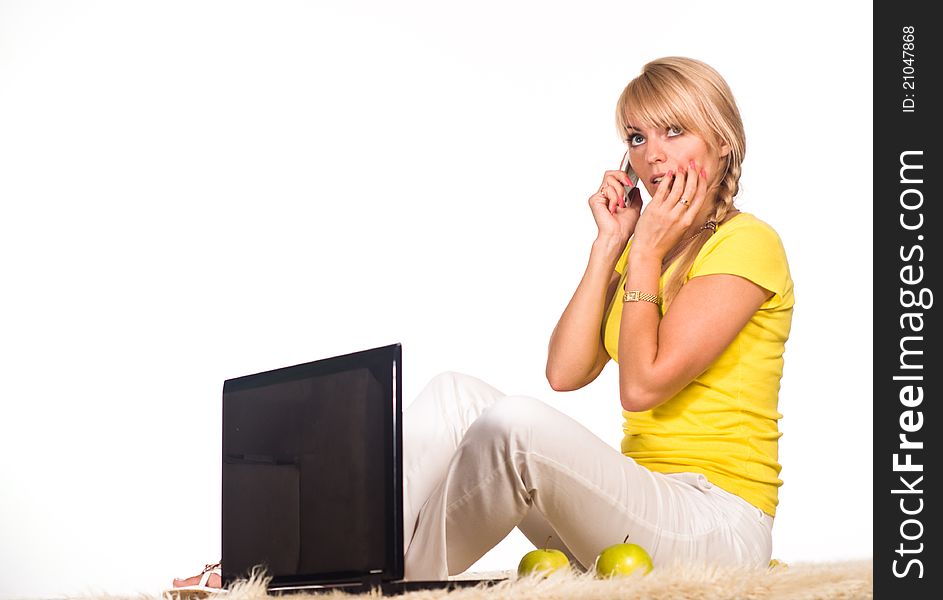 Cute girl lying on a carpet with laptop. Cute girl lying on a carpet with laptop