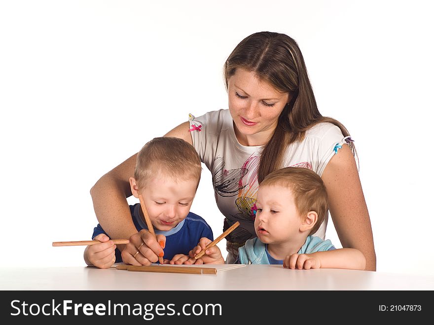 Portrait of a mom drawing with sons