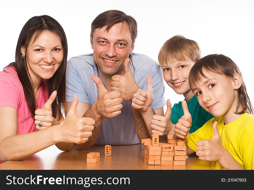 Portrait of a cute family playing at table. Portrait of a cute family playing at table