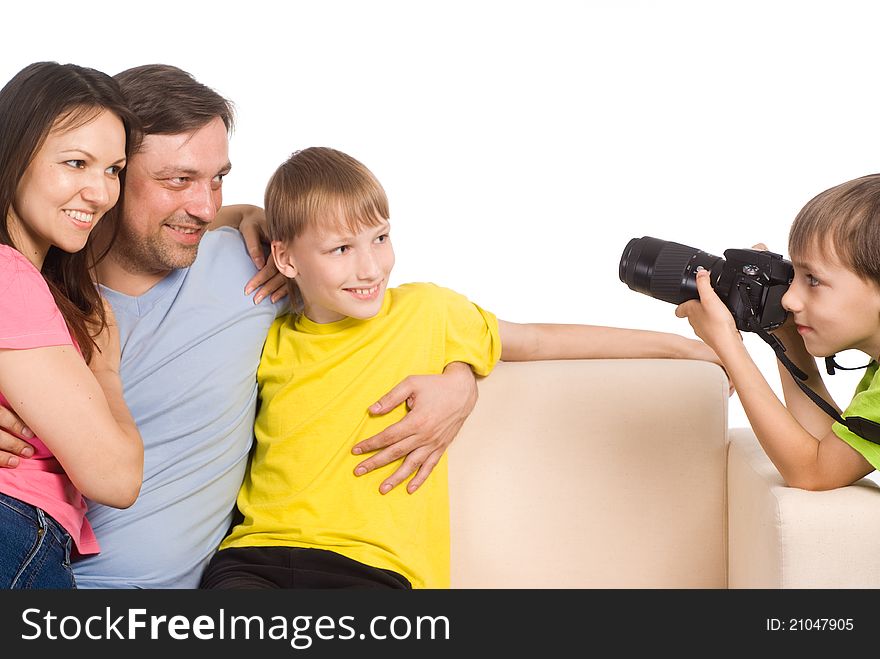 Kid with camera taking pictures of his family