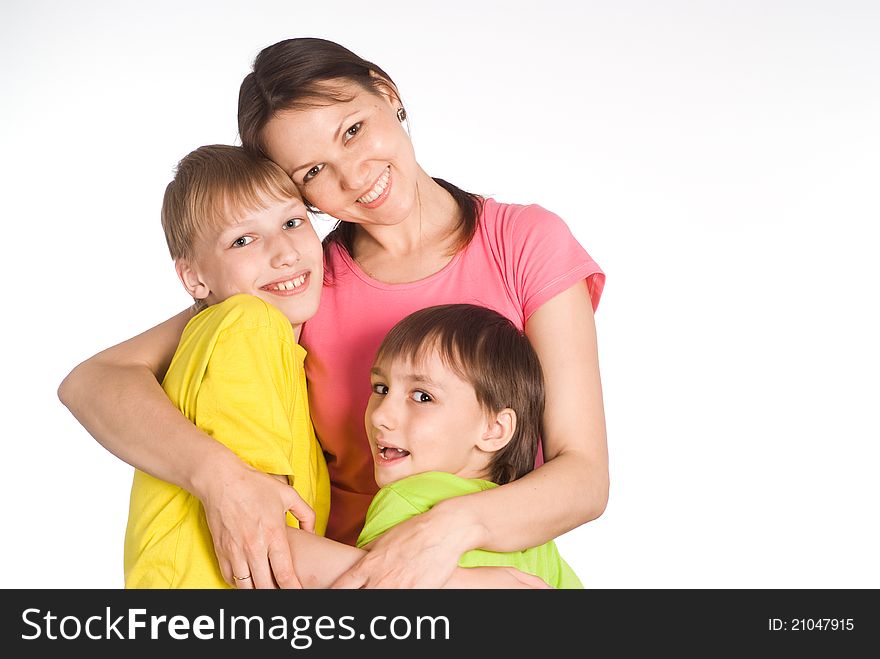 Cute mom with her boys on white. Cute mom with her boys on white