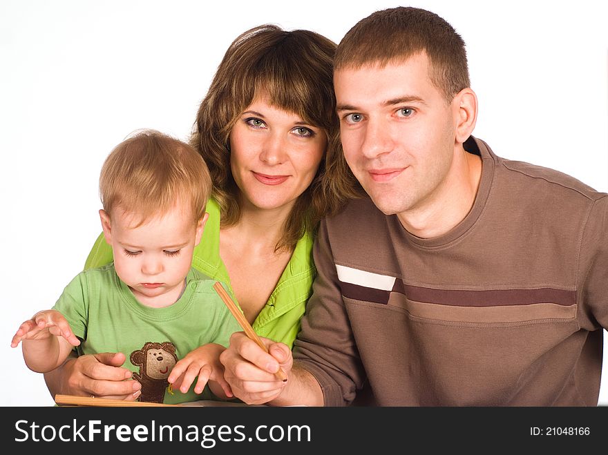 Portrait of a cute family drawing at table