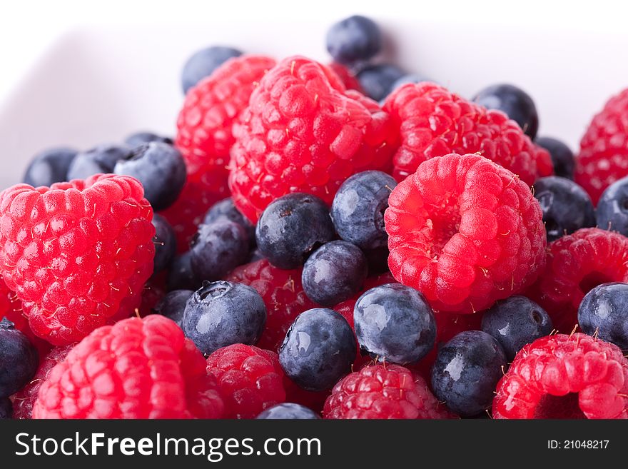 Close up of mixed berries in a bowl - shot in studio. Close up of mixed berries in a bowl - shot in studio