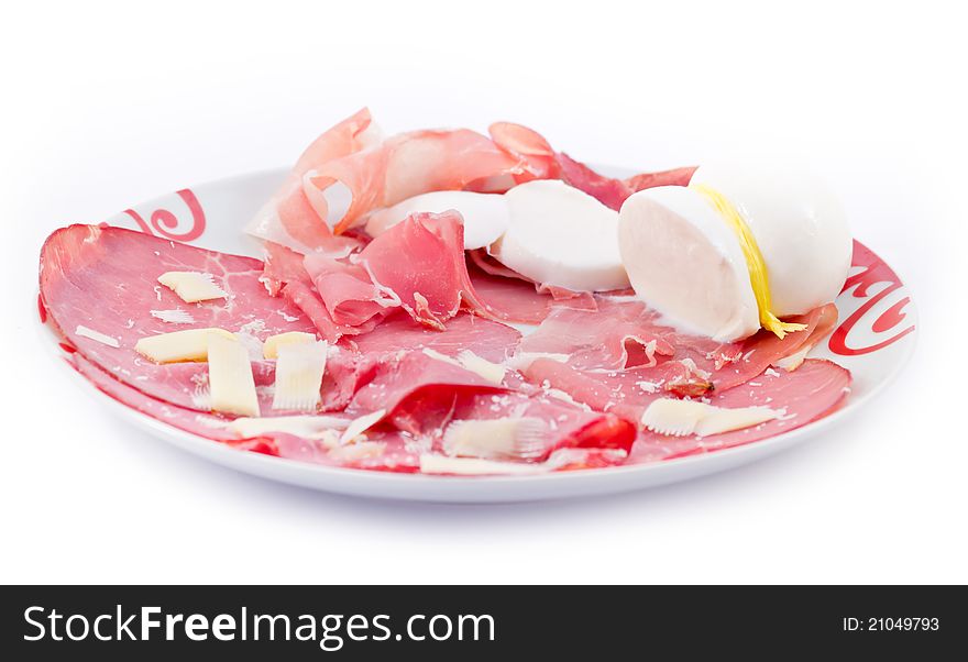 Parma ham and mozzarella served in a dish with parmesan