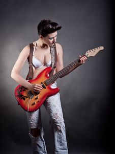 Sexy Girl With A Guitar Playing Rock Royalty Free Stock Photo