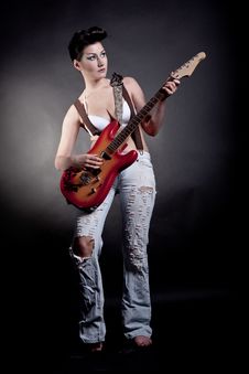 Sexy Girl With A Guitar Playing Rock Stock Photography