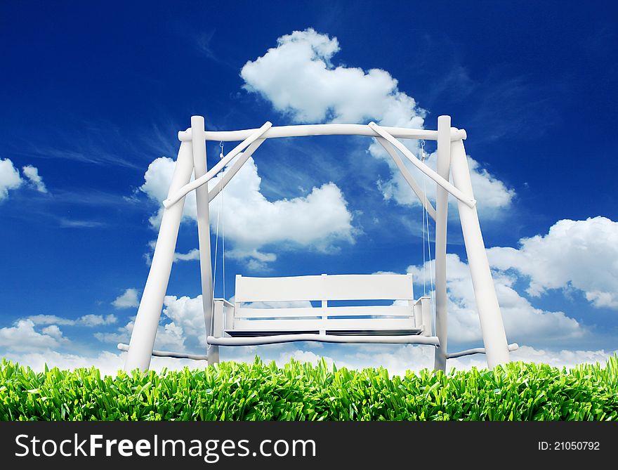 Abandoned swing on a field on a sunny day