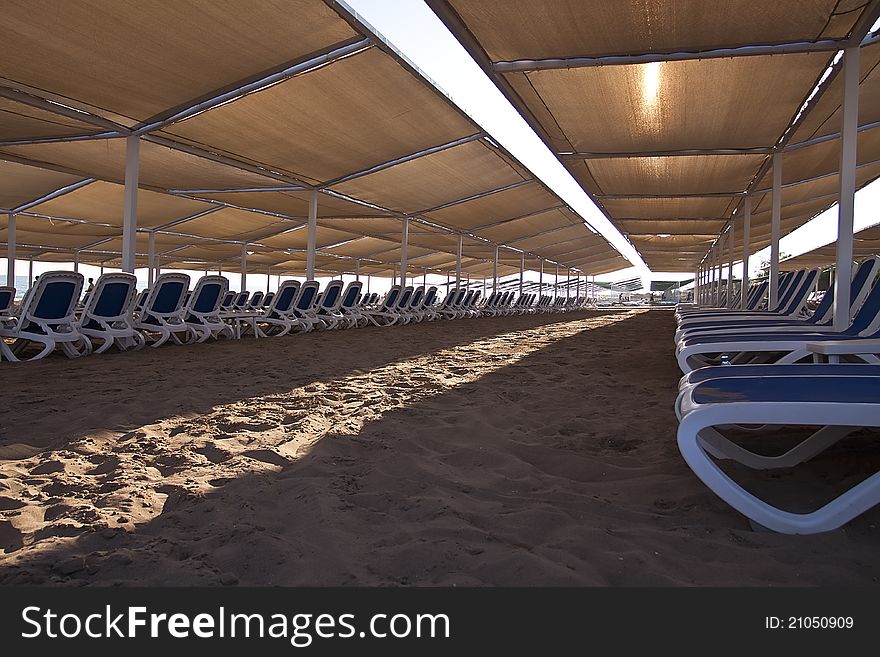 Many loungers on the beach.