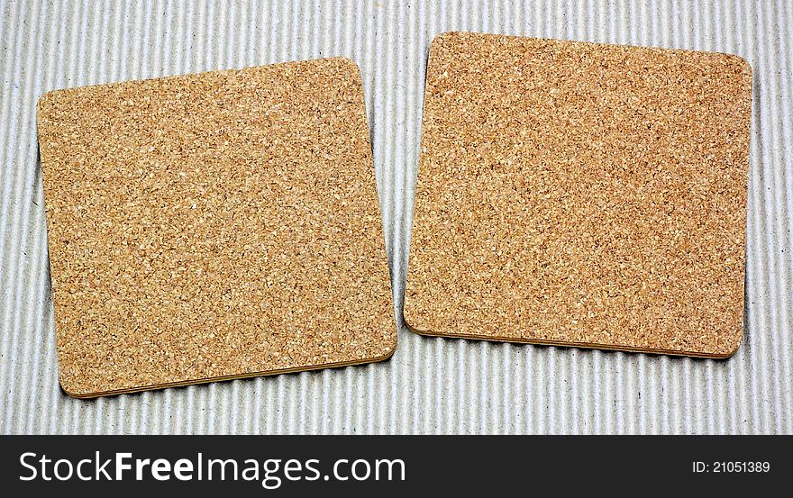 Two Blank Corkboards On Corrugated Paper