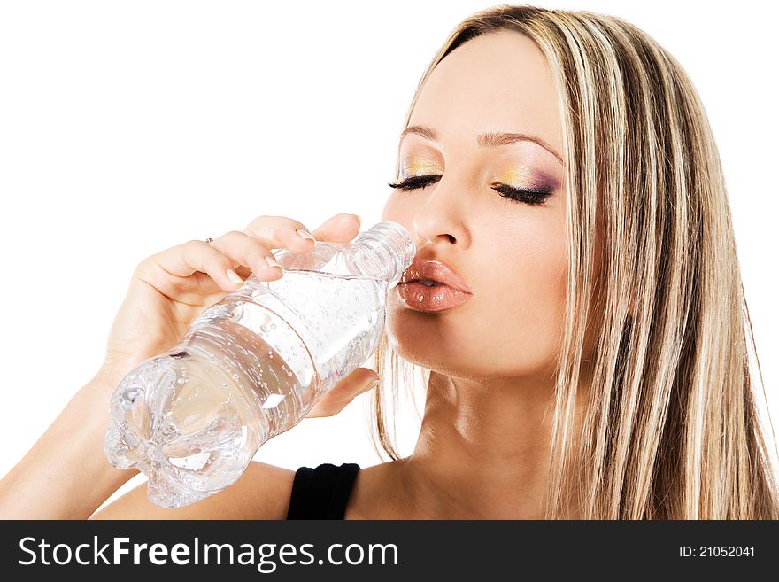 Young beautiful woman drinking water, white background