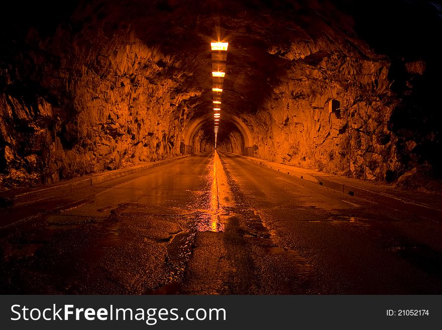A tunnel that cuts through one of the mountains in Yosemite National Park. A tunnel that cuts through one of the mountains in Yosemite National Park.