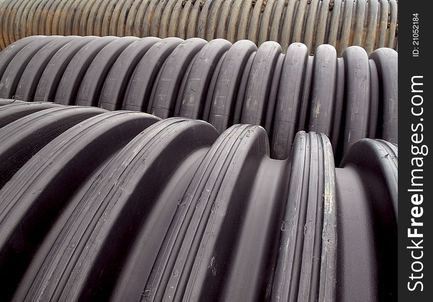 Rows of pvc drainage pipes lined up on the construction site