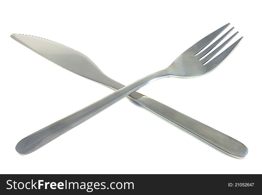 Knife and fork over white