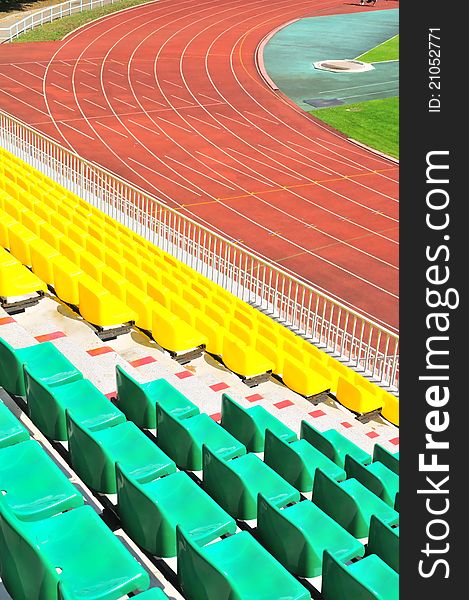 Colorful rows of plastic chairs at the stadium