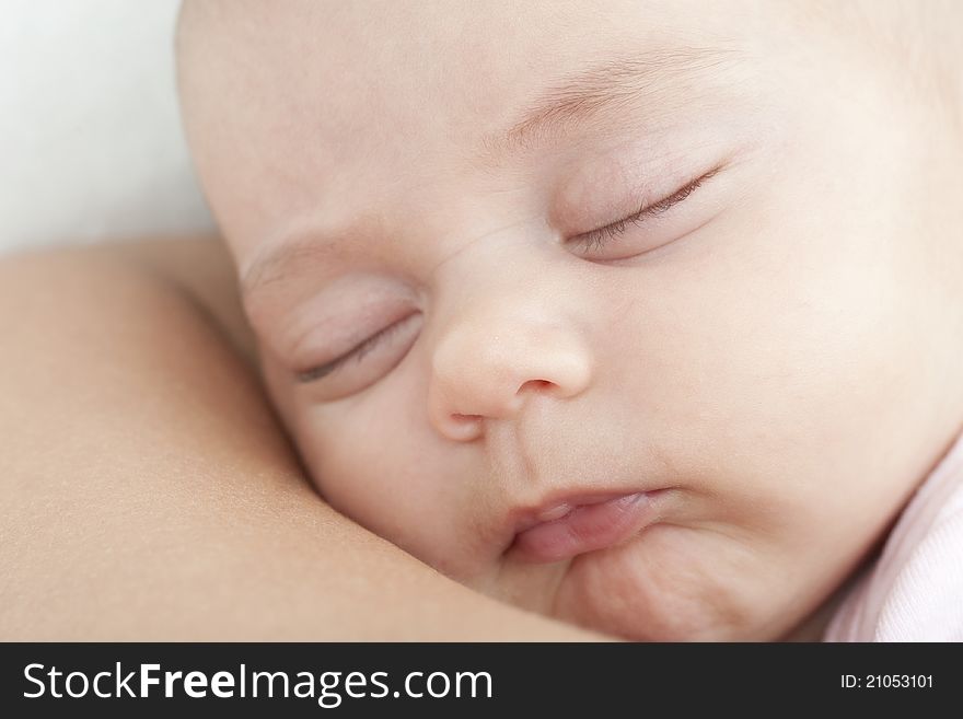 Newborn Sleeping On The Mother Shoulder