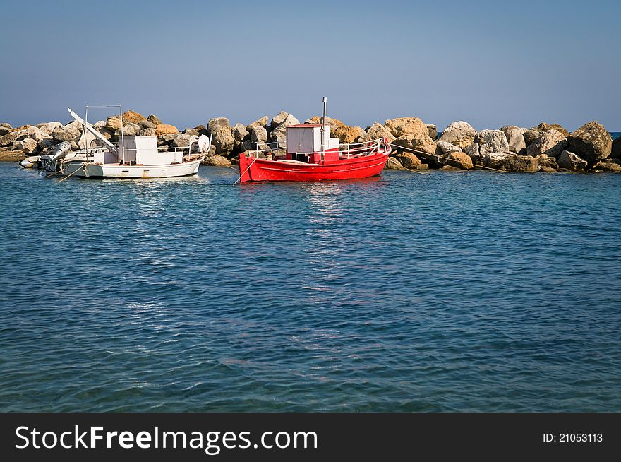 Two fishing boats moored in a harbour