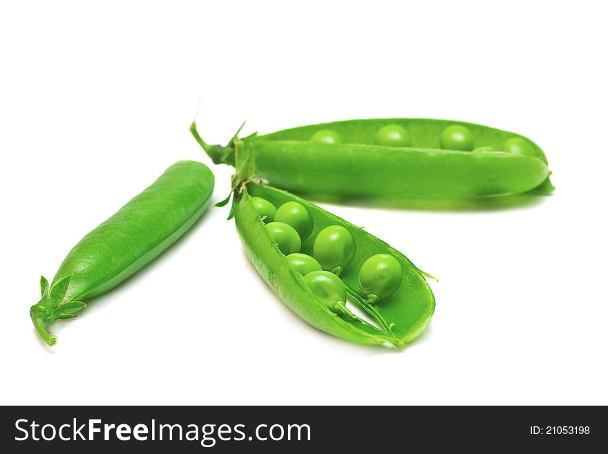 Fresh green pea in the pod isolated on white background