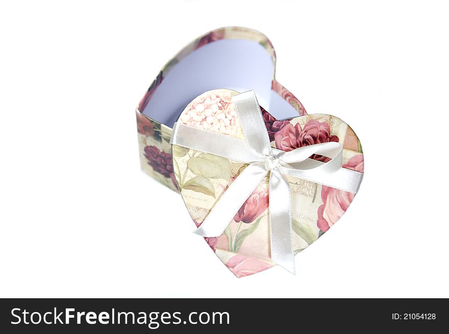 Opened heart-shape box on white background