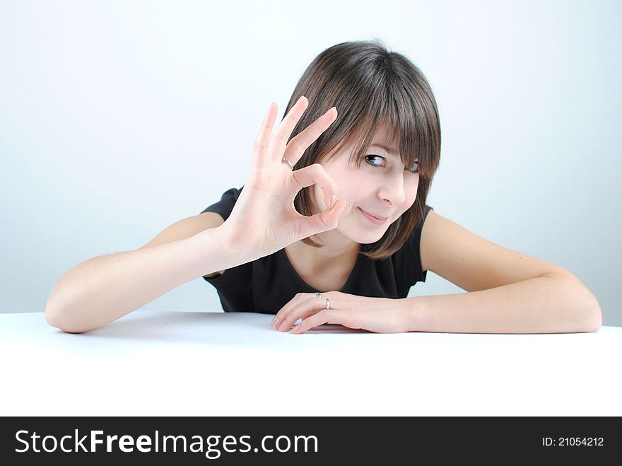 Teen girl learning at the desk gesturing