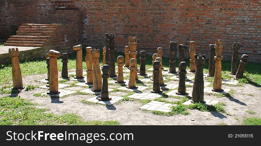 Old wooden chess figures outdoors. Old wooden chess figures outdoors