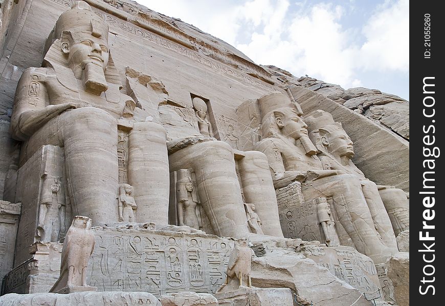 Detail of the facade with stone statues of ranses II in the Temple of abu simbel, Egypt