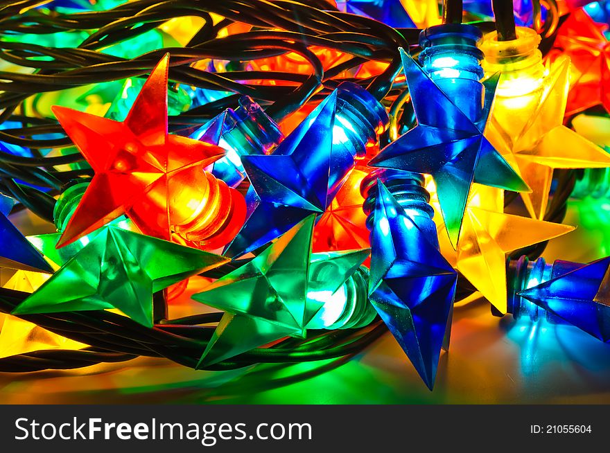 Garland of colored lights for Christmas trees. Spread out to a table