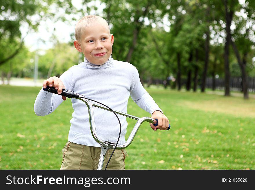 Boy On A Bicycle In The Green Park