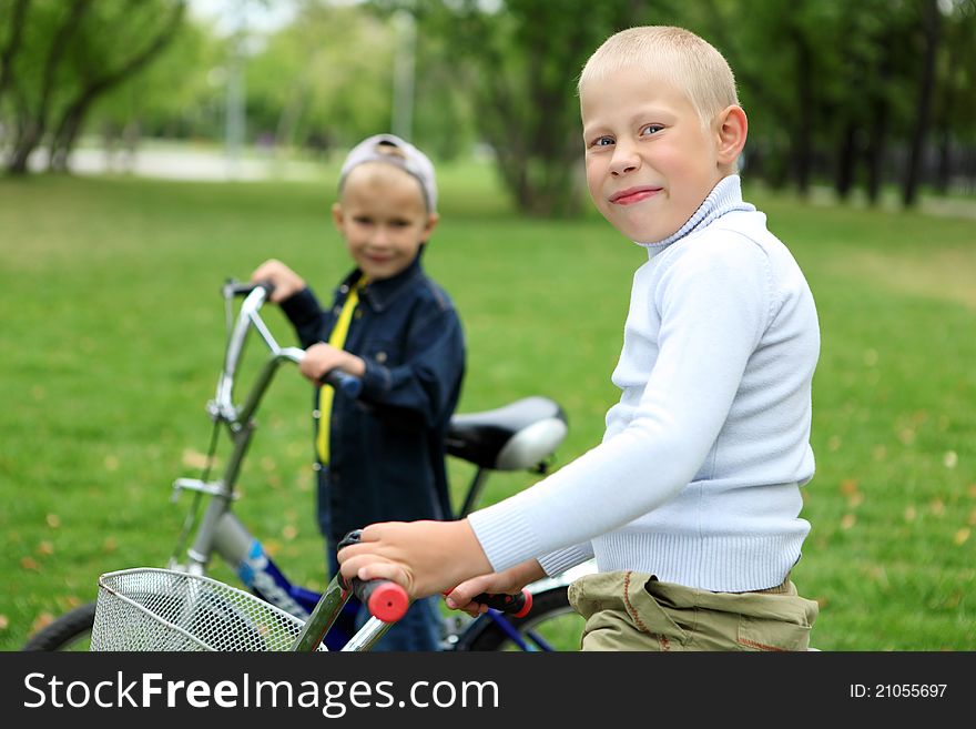 Boy on a bicycle in the green park