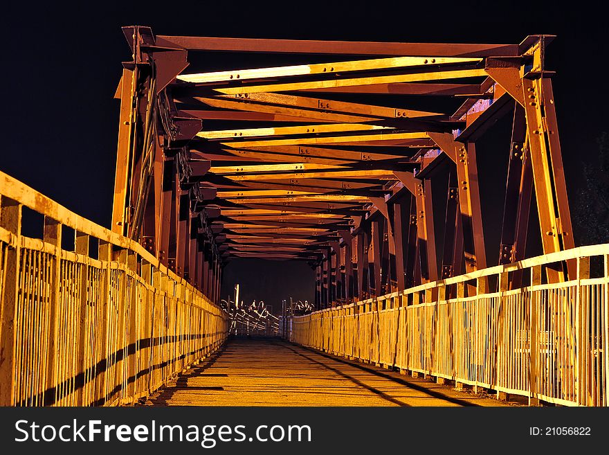 The strange bridge at night that conducts to electric wires. The strange bridge at night that conducts to electric wires