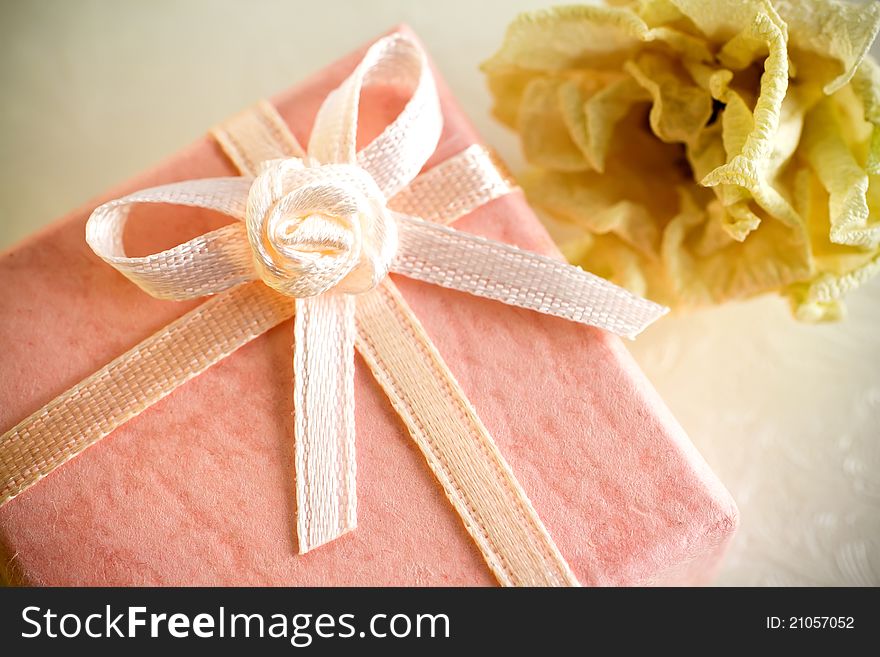 Pink gift box with a dry rose. Pink gift box with a dry rose.
