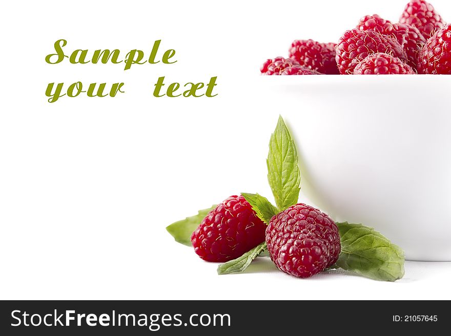 Raspberries in a white bowl on a white background. Raspberries in a white bowl on a white background