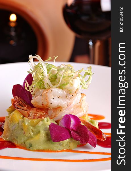 Pan seared shrimp over avocado guacamole and topped with finely shredded lettuce. Pan seared shrimp over avocado guacamole and topped with finely shredded lettuce.