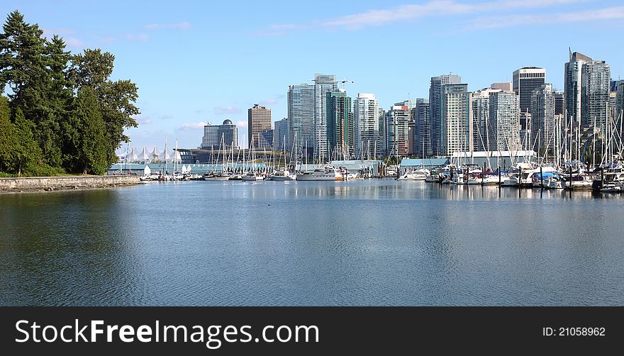 The Vancouver BC skyline along the waterfront and marina facing Stanley park. The Vancouver BC skyline along the waterfront and marina facing Stanley park.