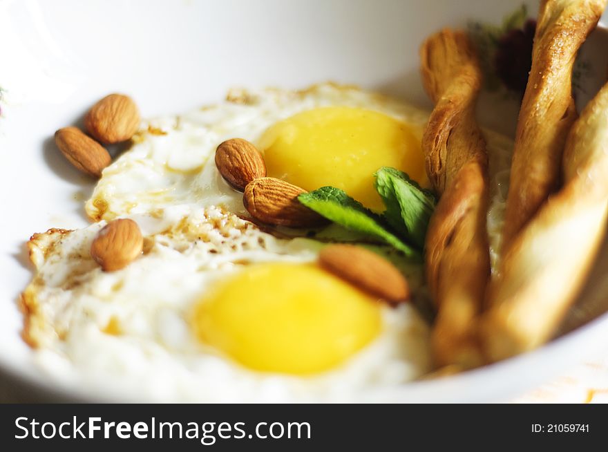 Fried Eggs, Almonds And Salty Crackers