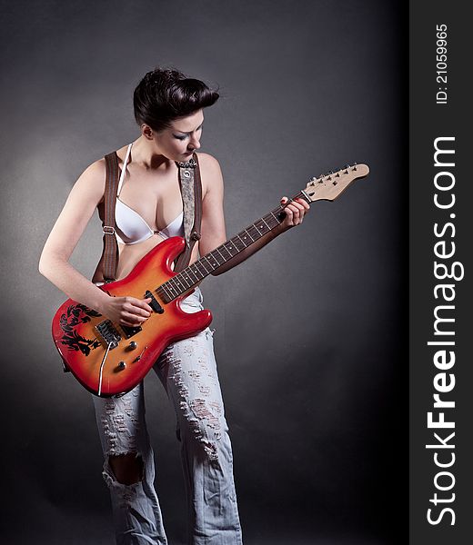 girl with a guitar playing rock with a guitar playing rock. girl with a guitar playing rock with a guitar playing rock