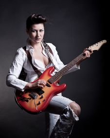 Sexy Girl With A Guitar Playing Rock Royalty Free Stock Images