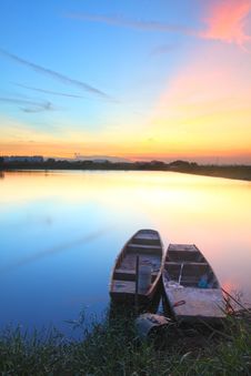 Sunset With Isolated Boats In Water Body Royalty Free Stock Photo Sunset With Isolated Boats In Water Body Royalty Free Stock Photo