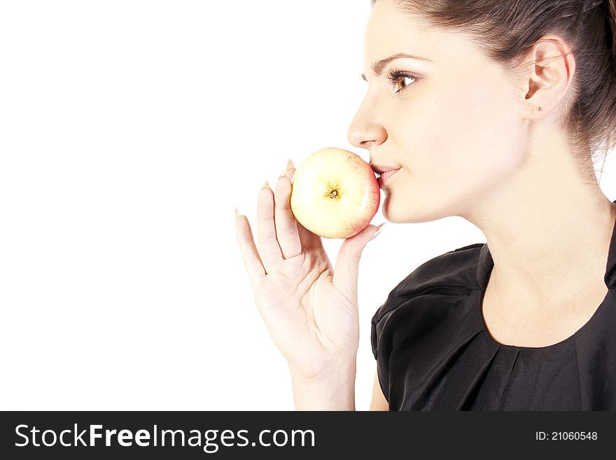 Young woman with apple in studio