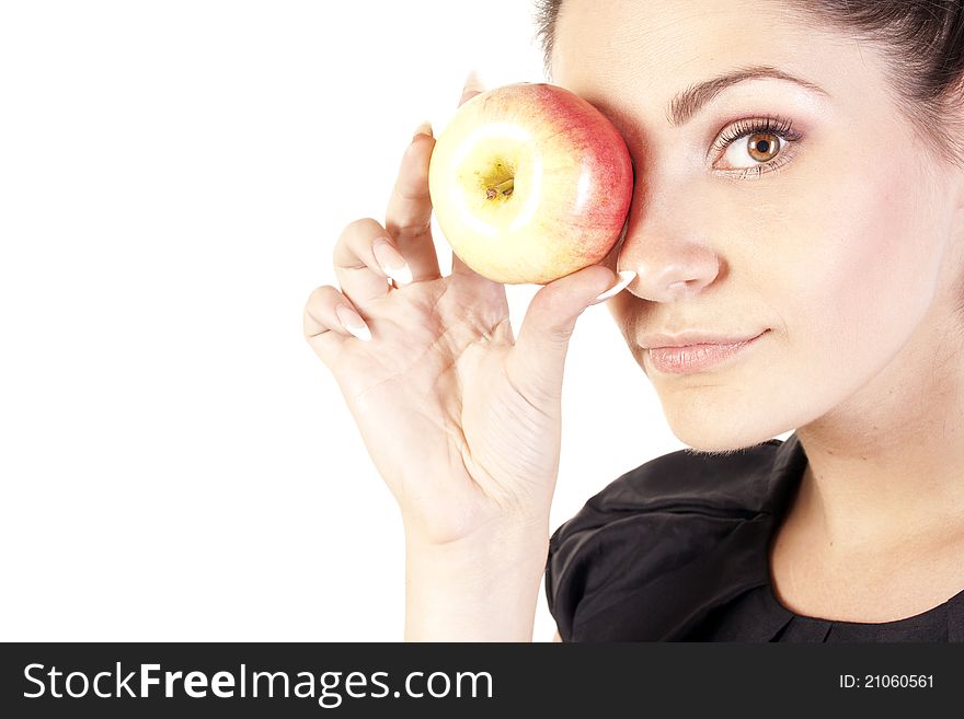 Young woman with apple in studio