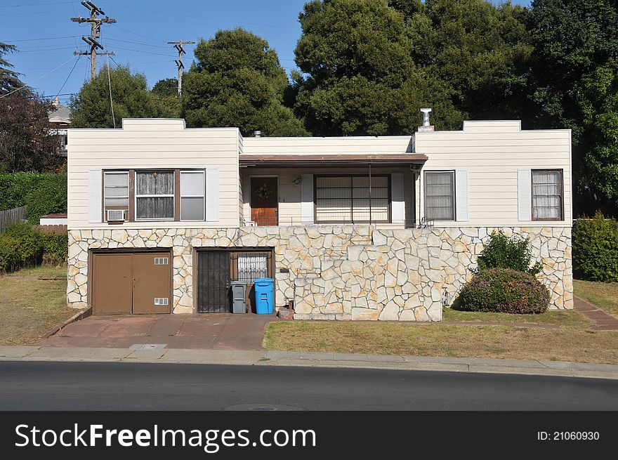 Single family house with one story and a short driveway. Single family house with one story and a short driveway