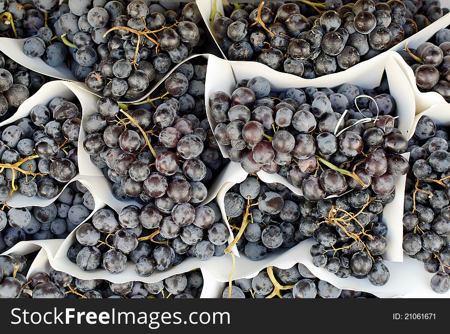 Display of red grapes in a market