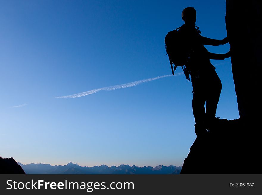 Silhouette of a climber with large copay space. Silhouette of a climber with large copay space