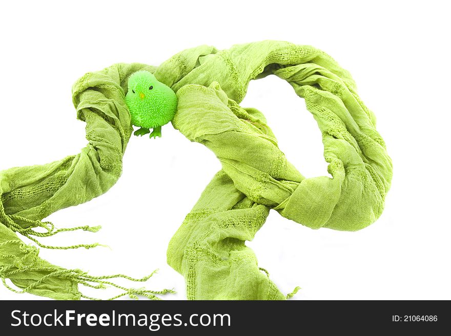 Green scarf with a toy