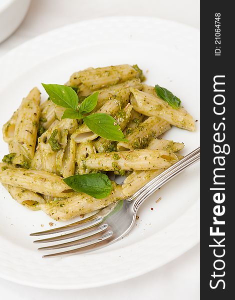 Healthy vegetarian pasta prepared with virgin olive oil and nutritious basil leaves. Healthy vegetarian pasta prepared with virgin olive oil and nutritious basil leaves.