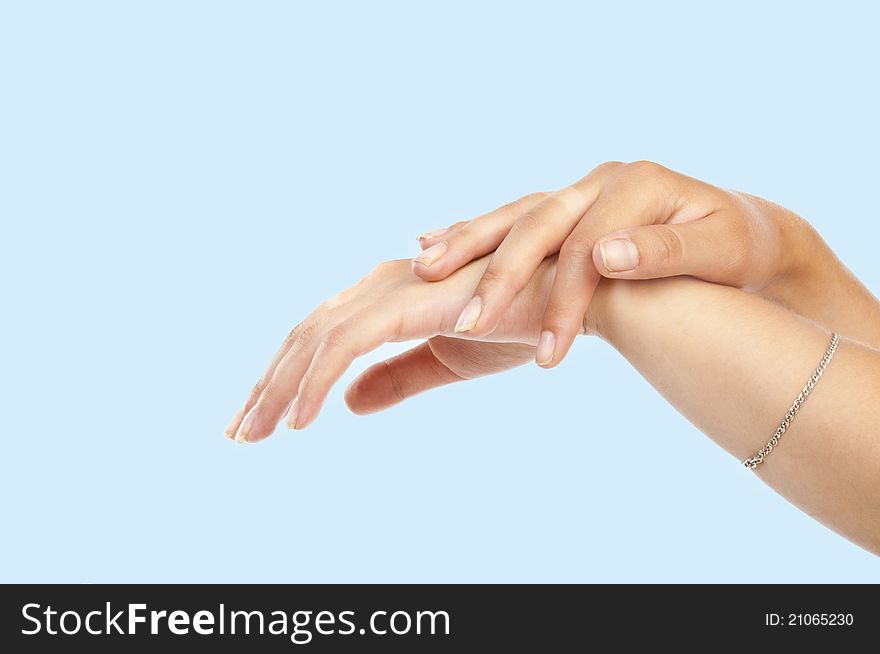 Women's hand on blue background