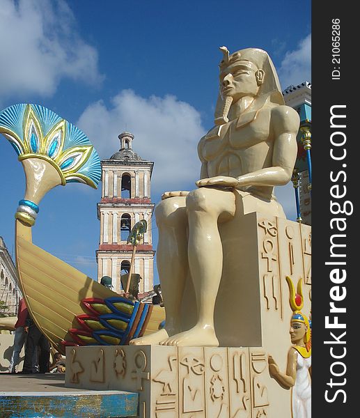 Float decorated with egyptian motives, with a pharaoh figure at front and a colonial church at bottom, at Remedios village, Cuba, as part of a carnival at the Christmas day.