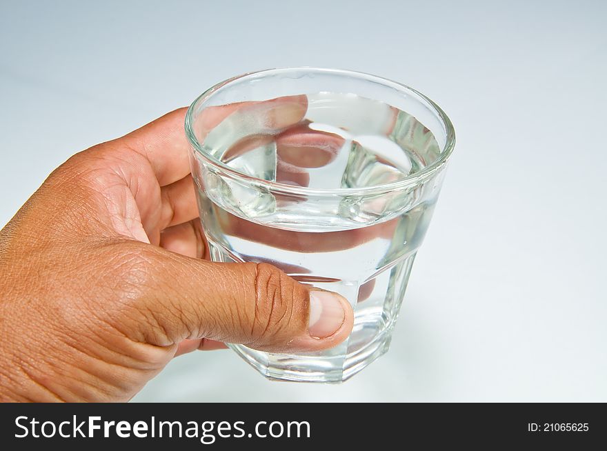 Hand with a water glass.