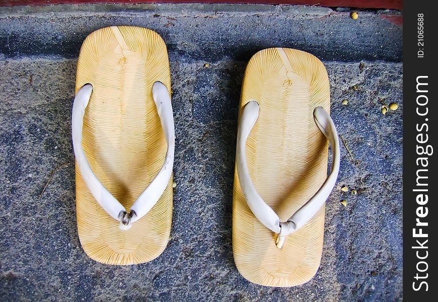 Sandal with a thick sole of wood , Japanese Style .